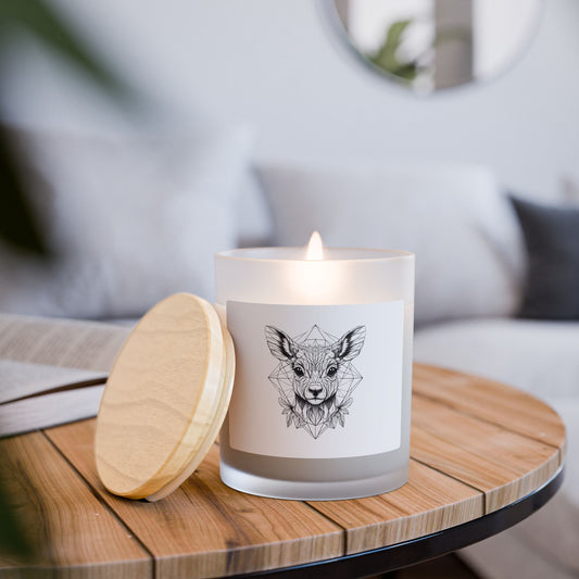 Burning Candle with a line drawing of a deer design on a wooden table with a bamboo lid