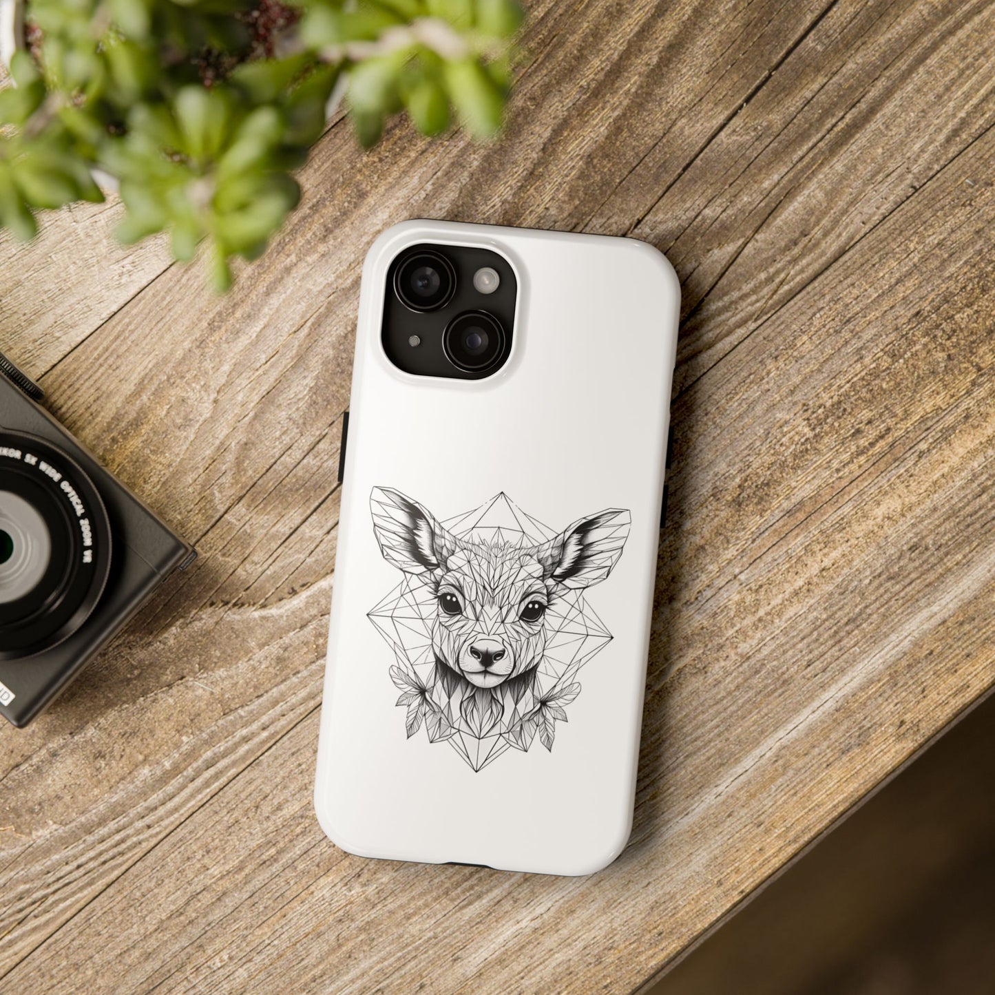 White_iPhone_Phone_case_with_a_black_geometric_deer_design_on_a_wooden_surface polycarbonate (shell), TPU (lining) 2-piece design with impact resistance and shock dispersion Interior rubber liner for extra protection (appearance may vary across 